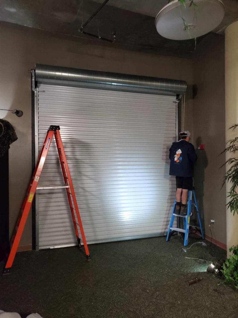 Trinity technicians working on a garage door in Land O' Lakes