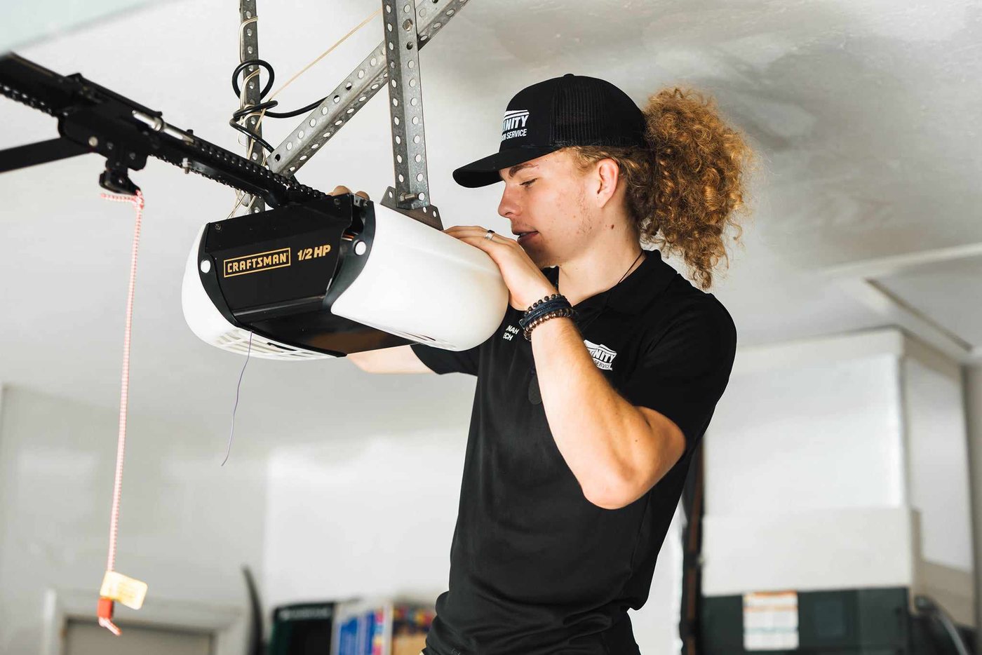Trinity technician servicing a garage door opener