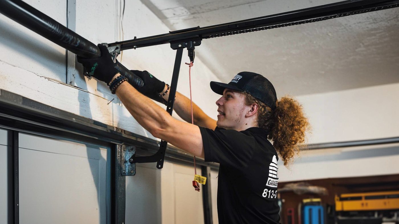 Trinity technician balancing a garage door