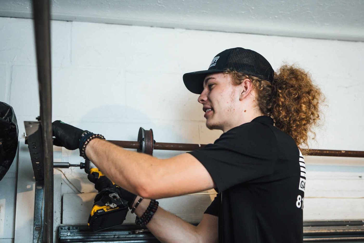 Trinity technician replacing a garage door spring