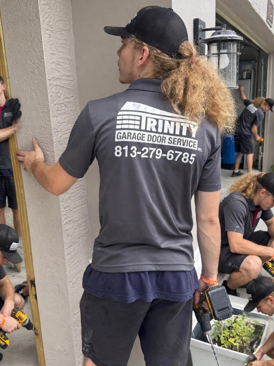 Trinity crew on a job in branded shirts