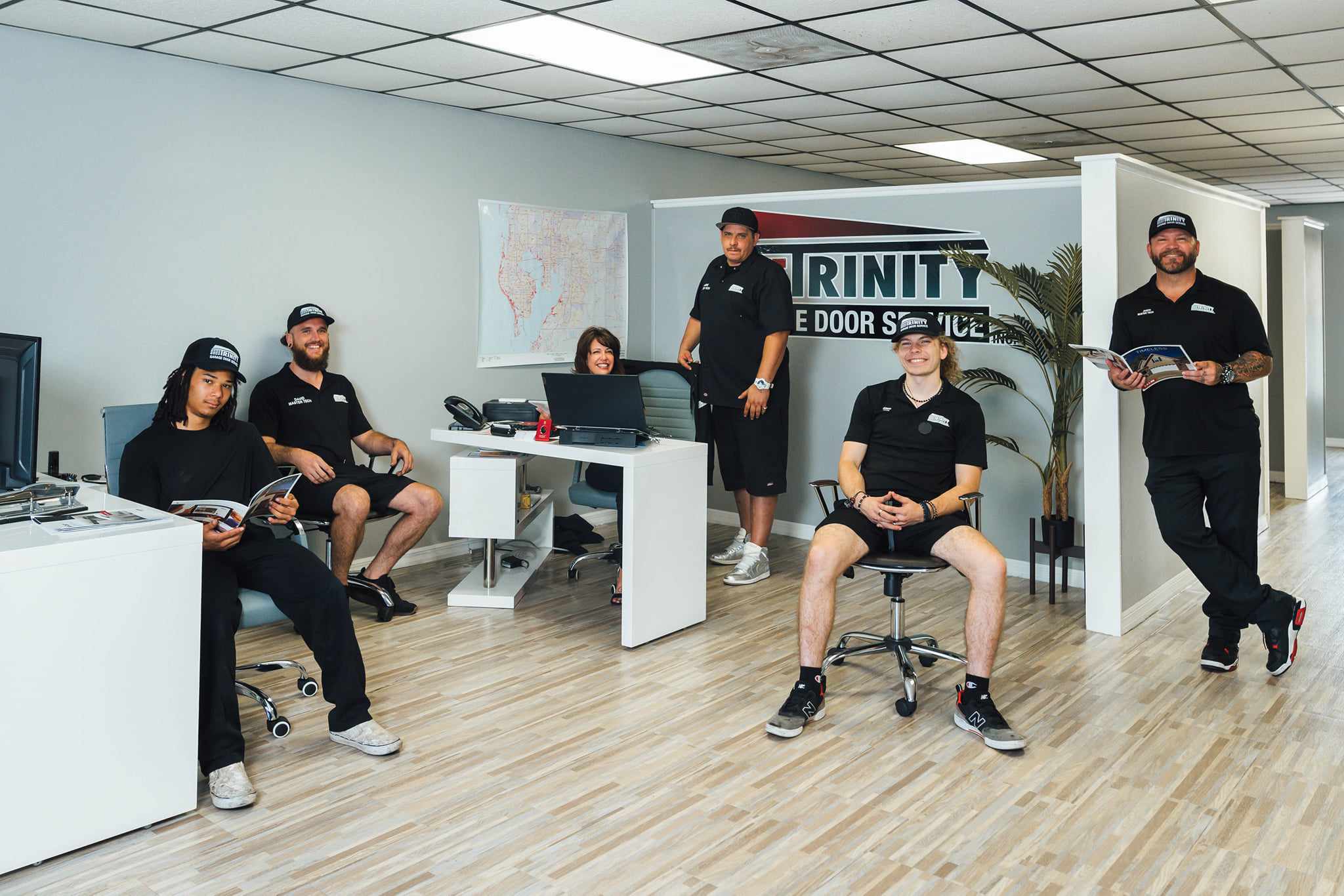 The Trinity Garage Door team in their Tampa Bay showroom