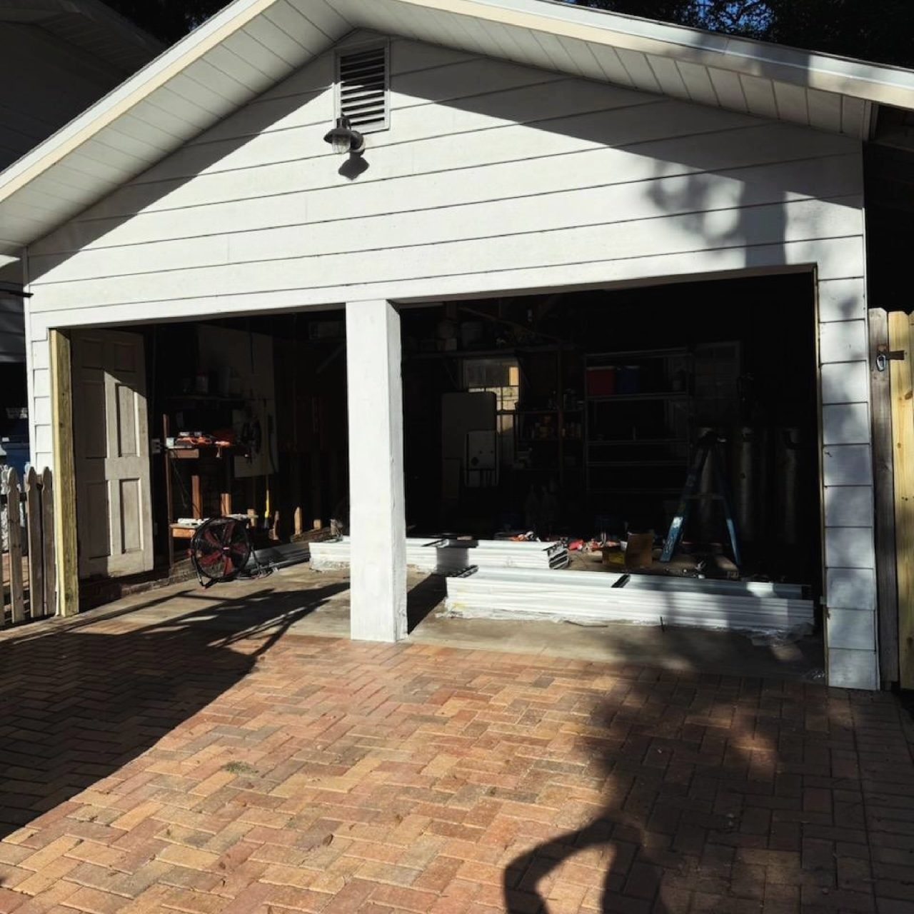Before: open carport converted to an enclosed garage with a new door