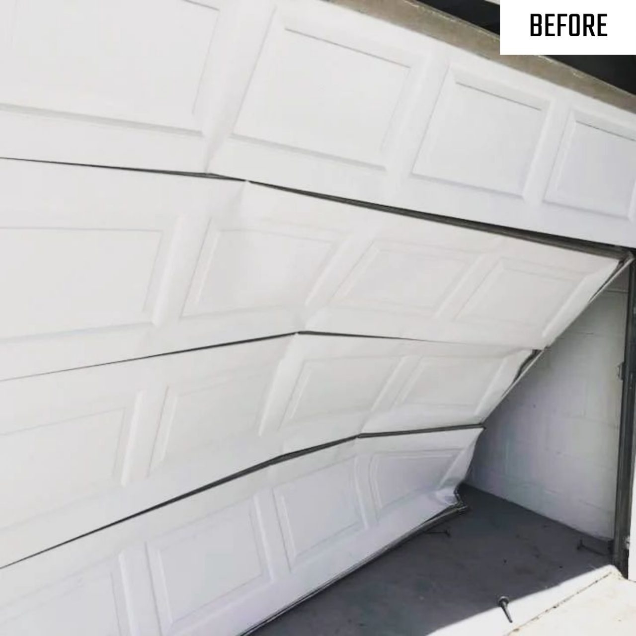 Before: dented garage door replaced with a straight new door