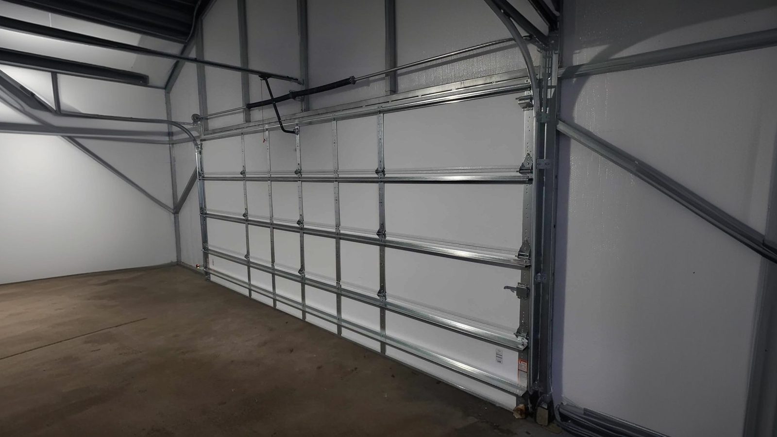 Garage door track and rail hardware inside a finished garage